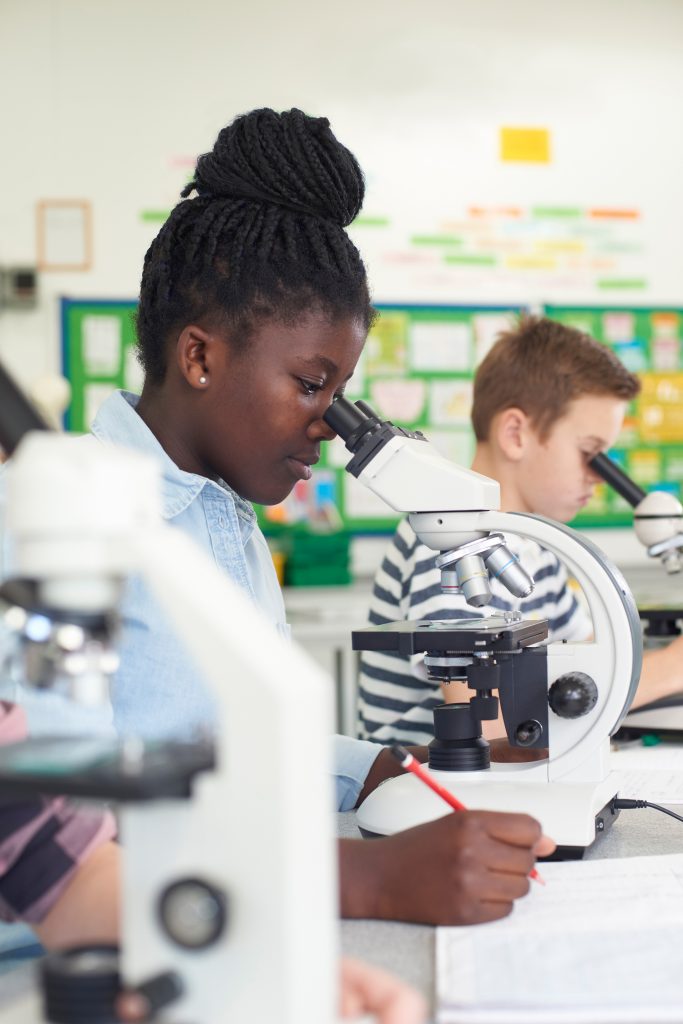 Science: Girl and microscope