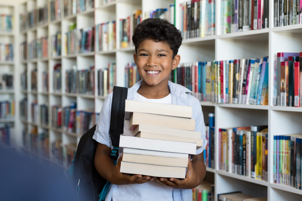 Boy holding books