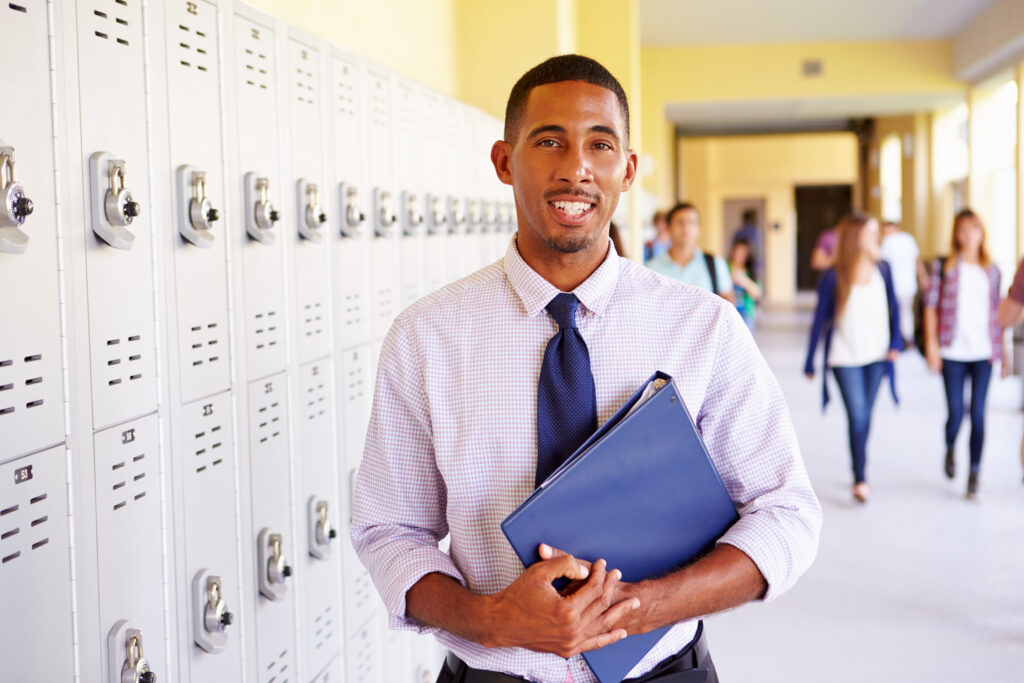 Male teacher in hallway